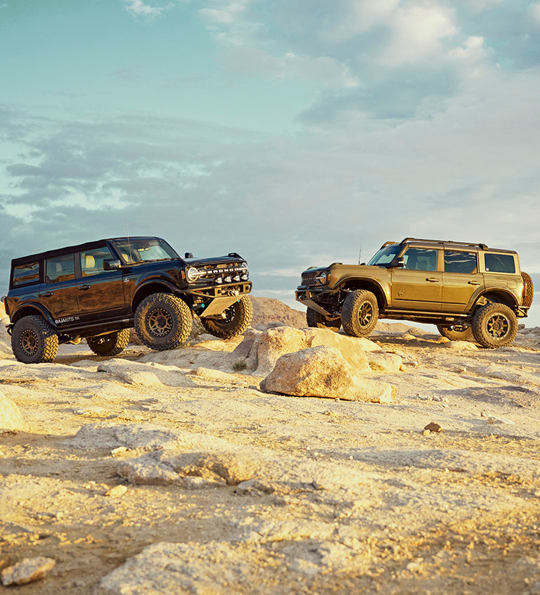 Ford Broncos offroad on Method Race Wheels Standard wheels.